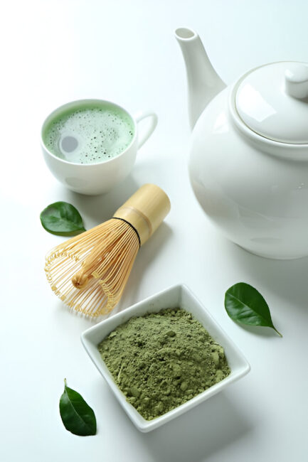 Matcha tea with whisk, teapot, and green tea powder